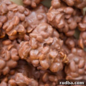 Effortless Slow Cooker Candies 2 crockpot candy clusters on a baking sheet up close.