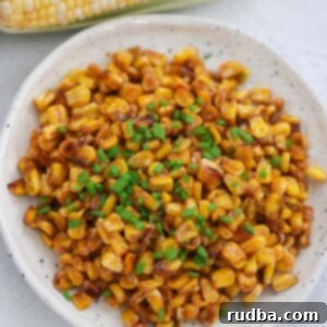 Zesty Cajun Corn Medley 2 Cajun fried corn with chives on top.