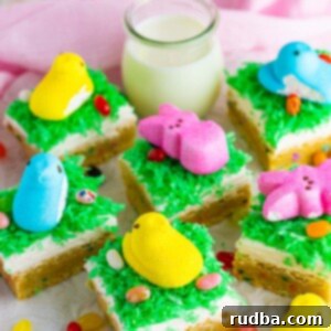 Easter sugar cookie bars with jelly beans, milk, and peep candies on the side.
