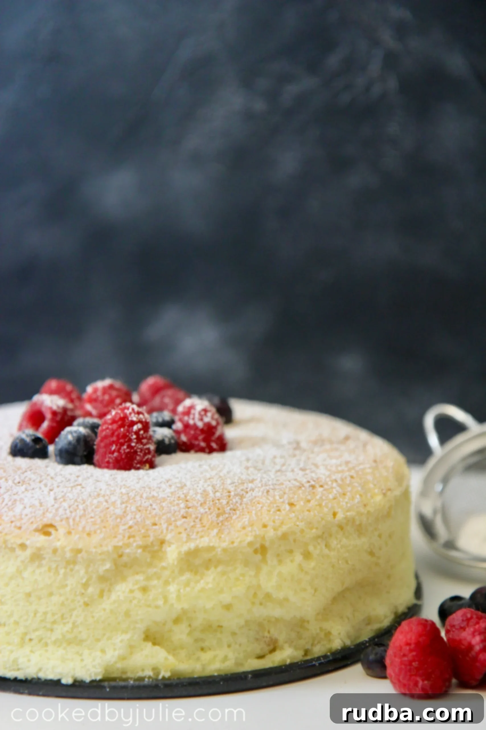 Japanese Cotton Cheesecake with fresh fruit and powdered sugar
