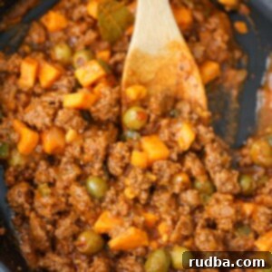 picadillo with sweet potatoes in a skillet.