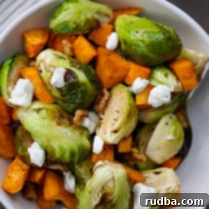 Roasted brussel sprouts and sweet potatoes with goat cheese on top.