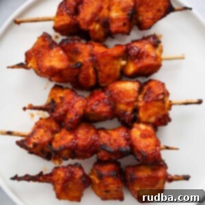Crispy Air Fryer Chicken Kabobs 2 five air fryer chicken kabobs on a white plate