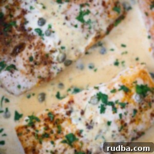 creamy mahi mahi fillets in a skillet.