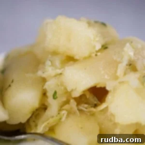 Crispy Yuca with Zesty Mojo 2 Yuca con Mojo on a plate with a spoon on the side, ready to be served.