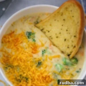 A comforting bowl of creamy broccoli cheese soup, garnished and ready to serve.