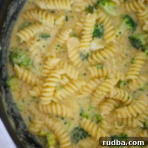 Creamy Cheddar Broccoli Pasta 2 broccoli cheddar pasta in a skillet.