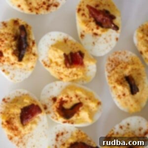 Divine Deviled Eggs 2 million dollar deviled eggs with bacon on top.