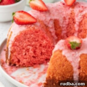 Berry Bliss Bundt 2 Strawberry bundt cake on a white plate.