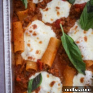 Cheesy Baked Rigatoni 2 Baked rigatoni with fresh basil on top.