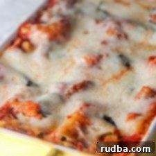 Garden Fresh Lasagna 5 Hearty Vegetable Lasagna with cheesy top and fresh basil garnish