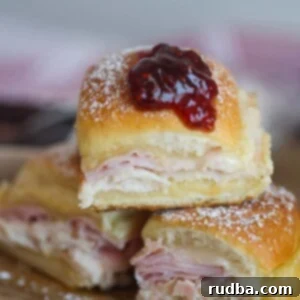 Monte Cristo Bites 2 Three monte cristo sliders on a cutting board.