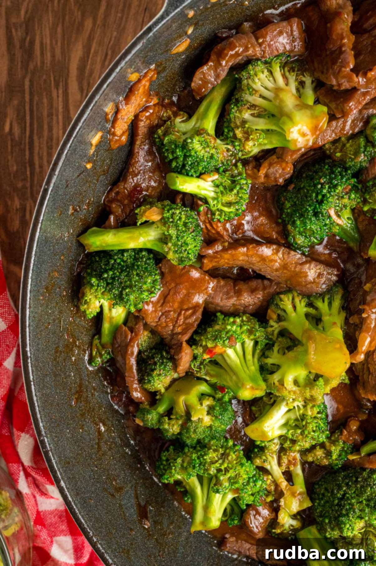 Classic Beef and Broccoli Stir Fry 5 Close-up of the finished beef and broccoli stir-fry, glistening with sauce and garnished with sesame seeds.