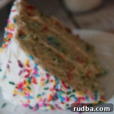 Whimsical Sprinkle Delight 5 Delicious Homemade Confetti Cake topped with sprinkles.