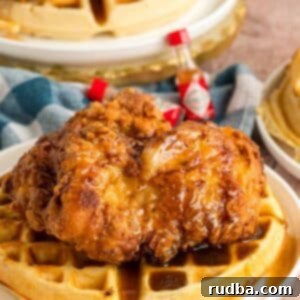 The Southern Sweet & Savory Stack 5 Southern fried chicken and waffles on a white plate.