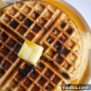 Chocolate chip waffle with butter and syrup.