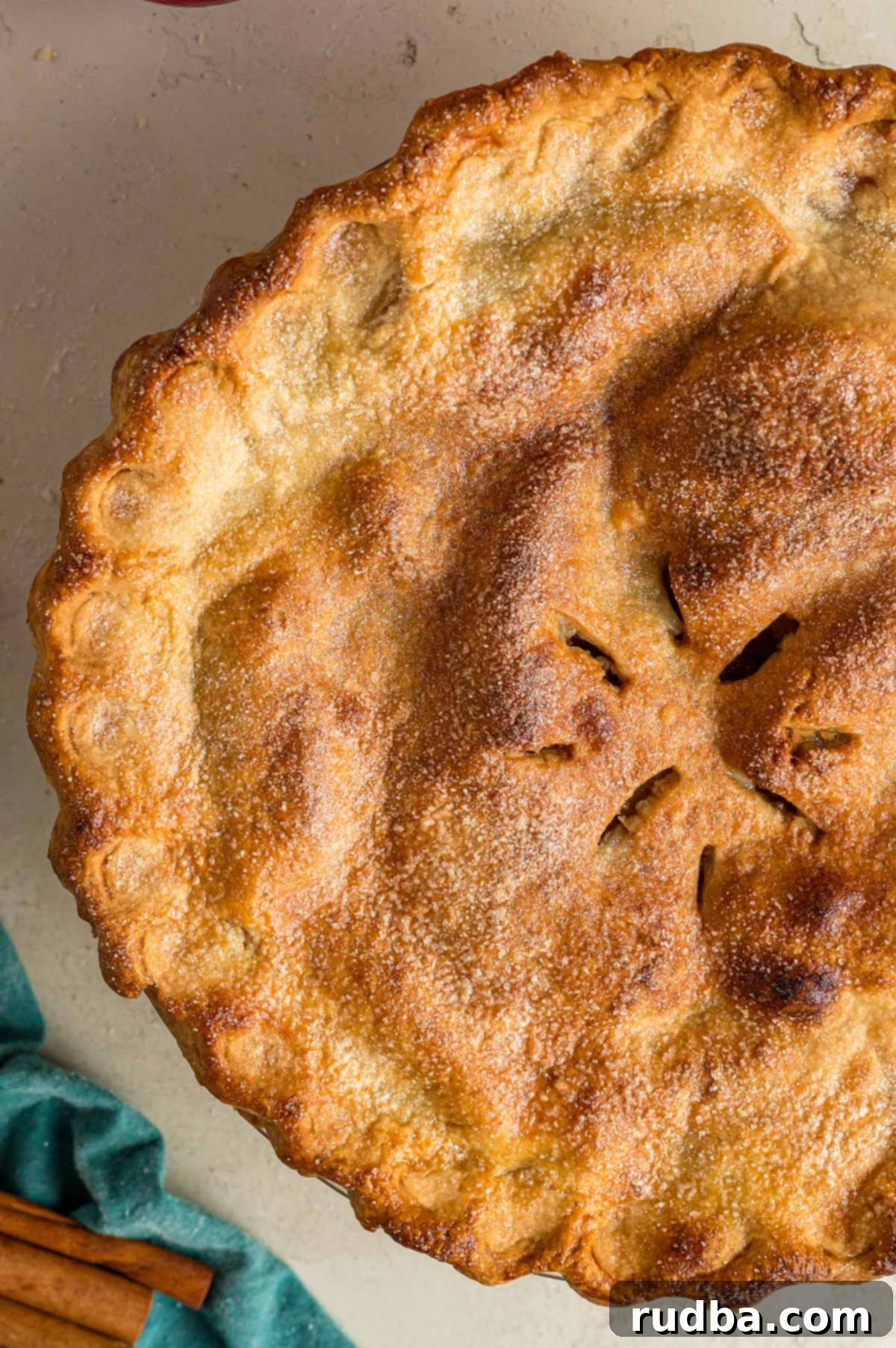 Warm Spiced Apple Pie 2 A beautifully baked homemade apple pie with a golden, flaky crust and a hint of steam rising, ready to be sliced.