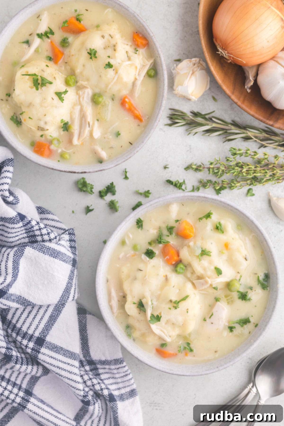 Hearty Homestyle Chicken and Dumplings 5 Two small bowls filled with chicken and dumplings.