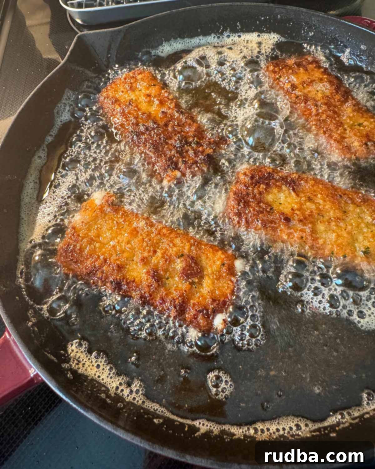 Honey Chipotle Mozzarella Poppers 4 The three dredging stations: flour, egg wash, and breadcrumbs, set up for coating the mozzarella sticks.