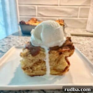 Authentic Cuban Bread Pudding 5 A slice of bread pudding with a scoop of vanilla ice cream on top.