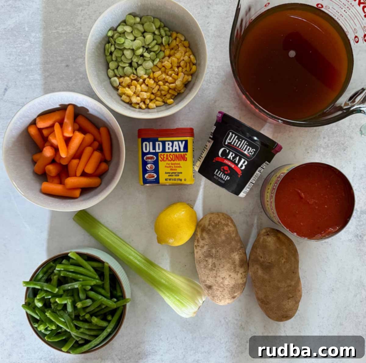Maryland's Iconic Crab Soup 3 Key ingredients for Maryland Crab Soup including crab meat, beef stock, various vegetables, potatoes, lemon, crushed tomatoes, and Old Bay seasoning.