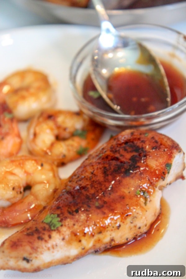 chicken and shrimp smothered in Jack Daniel's Sauce on a plate