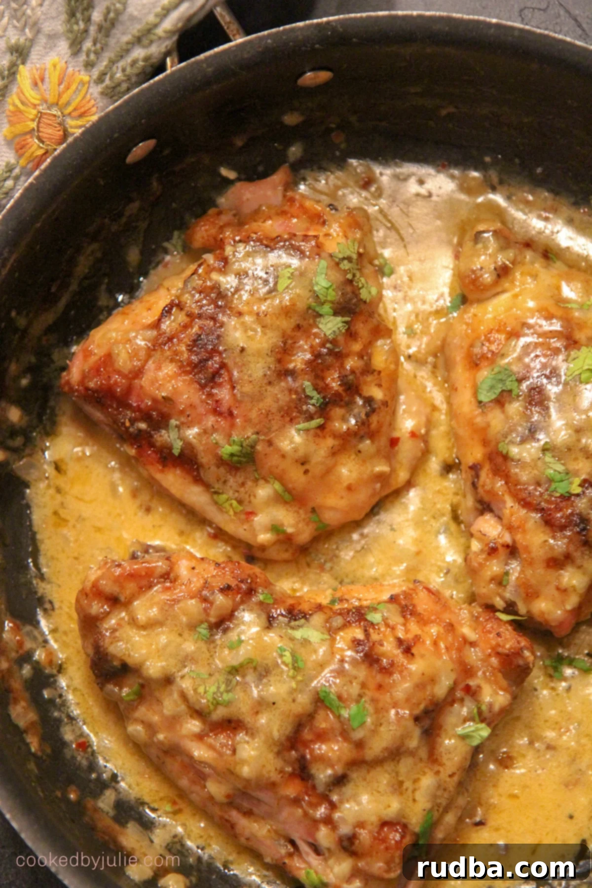 smothered chicken thighs with cream in a large pot