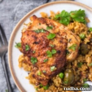 arroz con pollo (chicken and rice) on a plate.