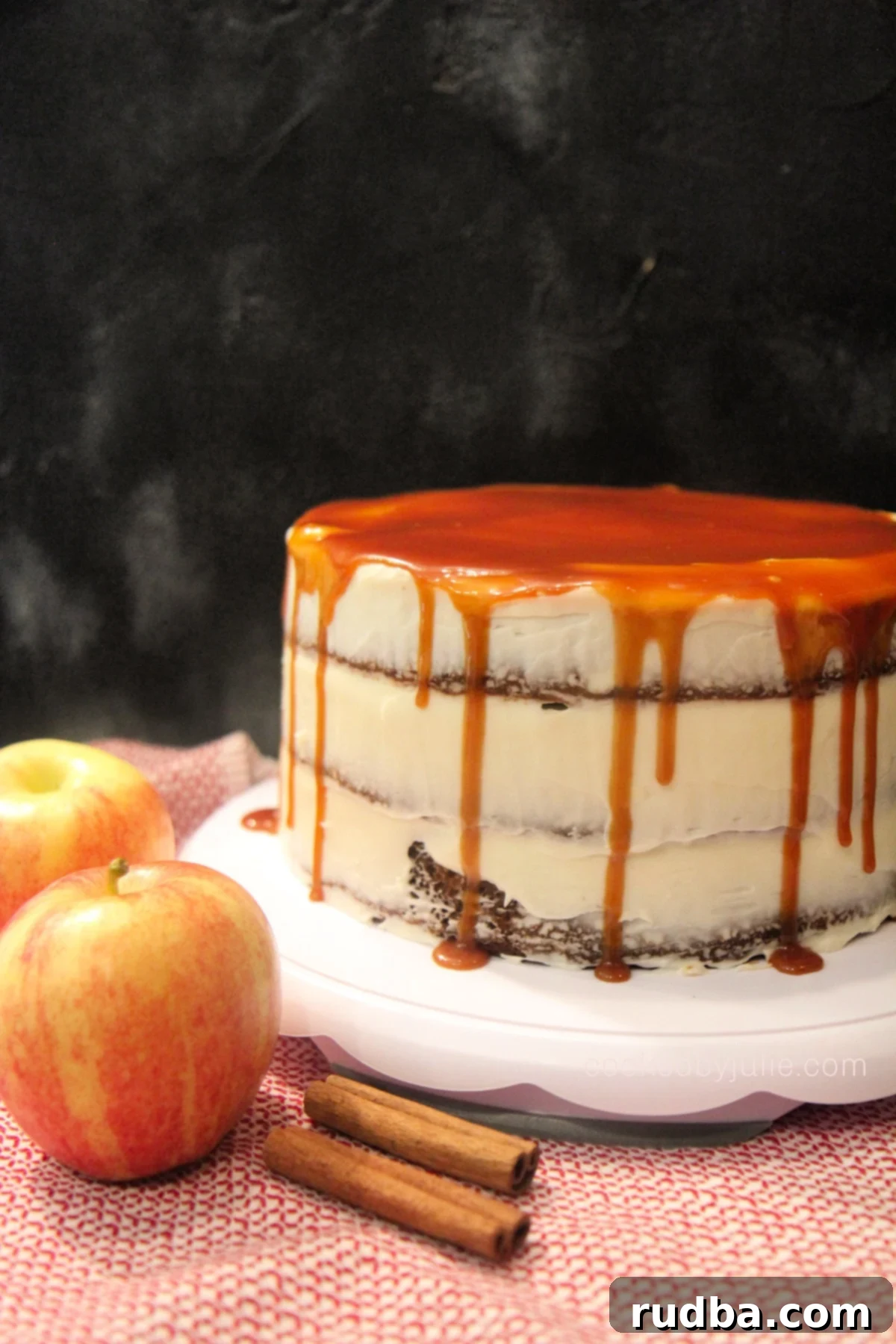 A gorgeous multi-layered caramel apple cake, frosted with elegant cream cheese and beautifully drizzled with rich caramel sauce.