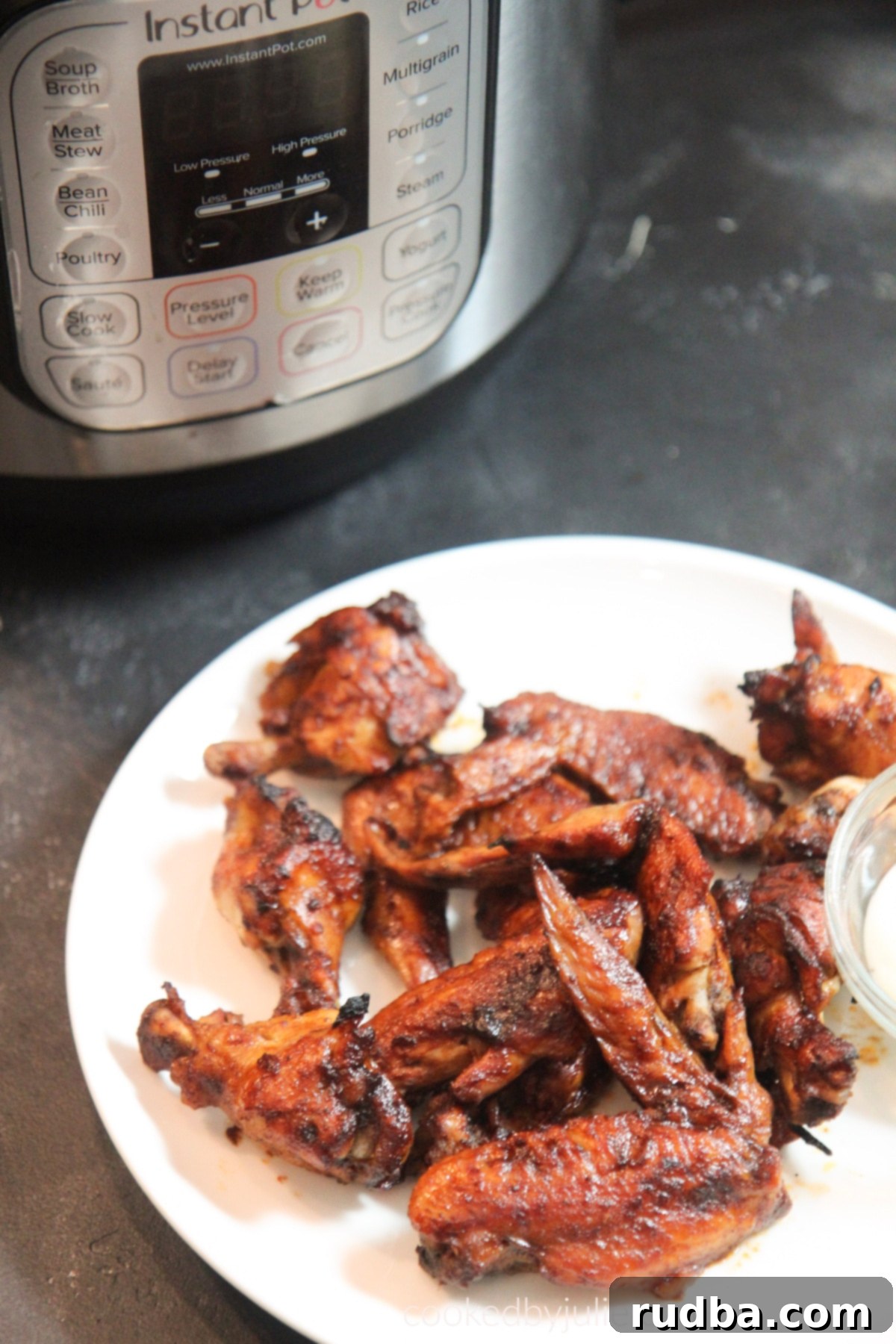 Perfectly pressure-cooked chicken wings, tender and ready for crisping.