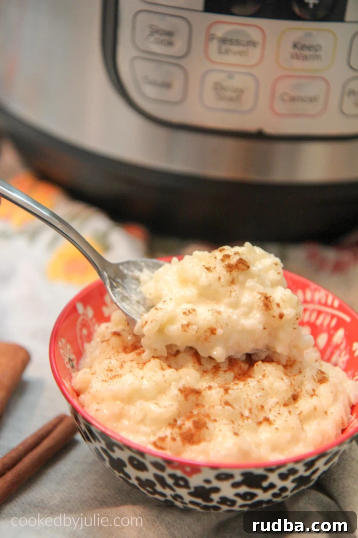Close-up of a spoonful of creamy Instant Pot Arroz con Leche, showcasing its rich texture.