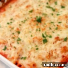 Make Your Own Olive Garden Baked Ziti 4 Olive garden baked ziti in a white casserole dish with fresh parsley on top
