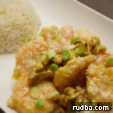 Honey-Glazed Crispy Walnut Shrimp 6 Honey Walnut Shrimp on a white plate