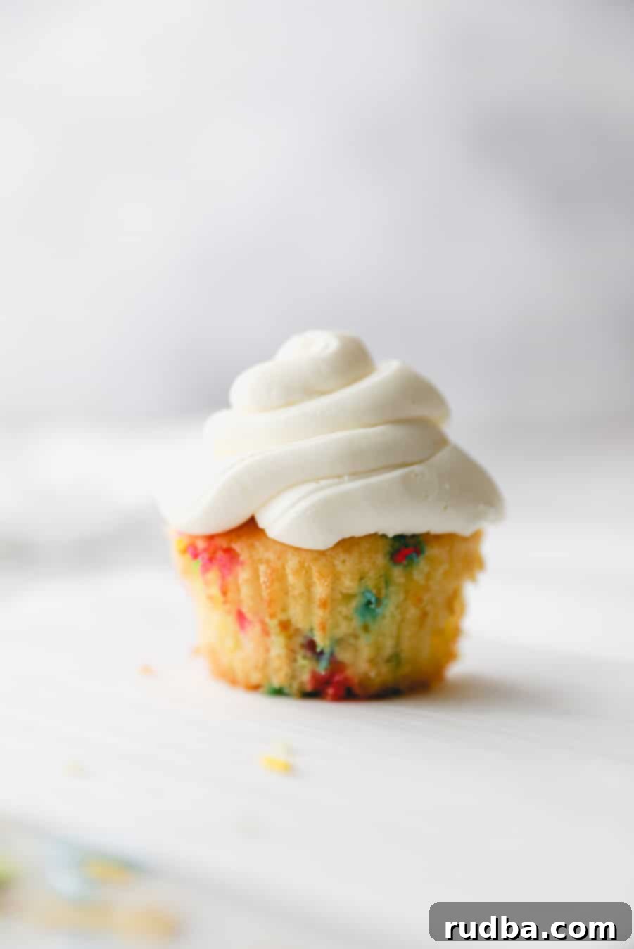 one funfetti cupcake with vanilla buttercream.
