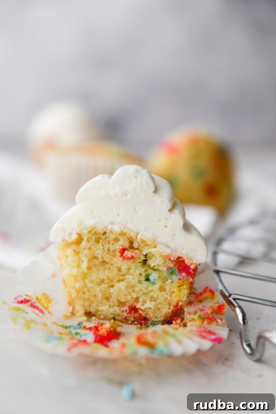 funfetti cupcake sliced in half up close. 