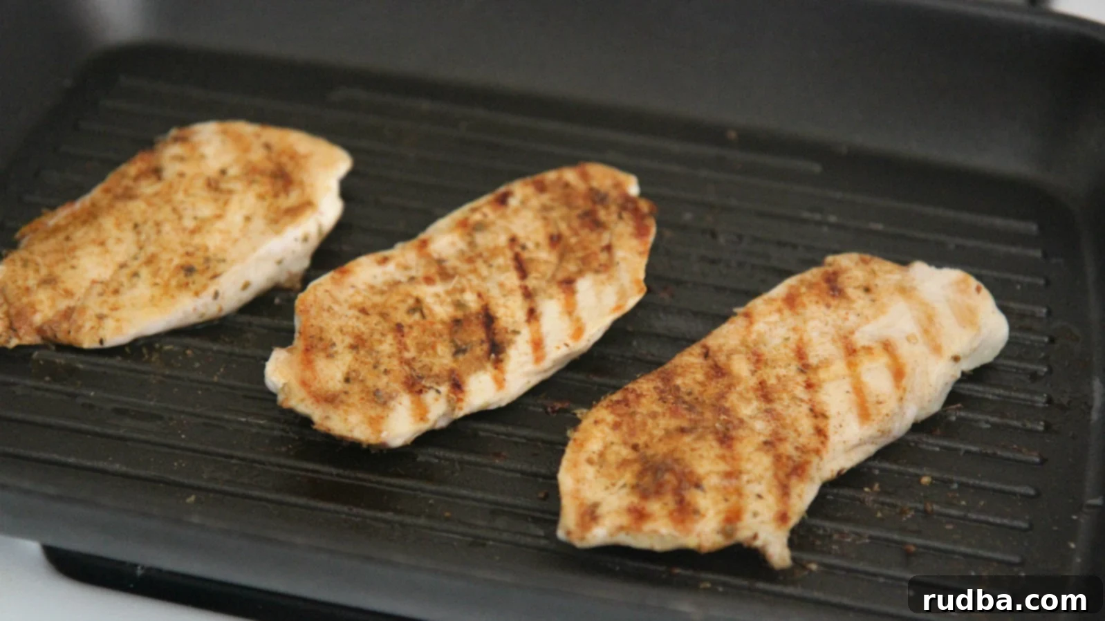Grill or pan-fry the chicken breasts until cooked through.