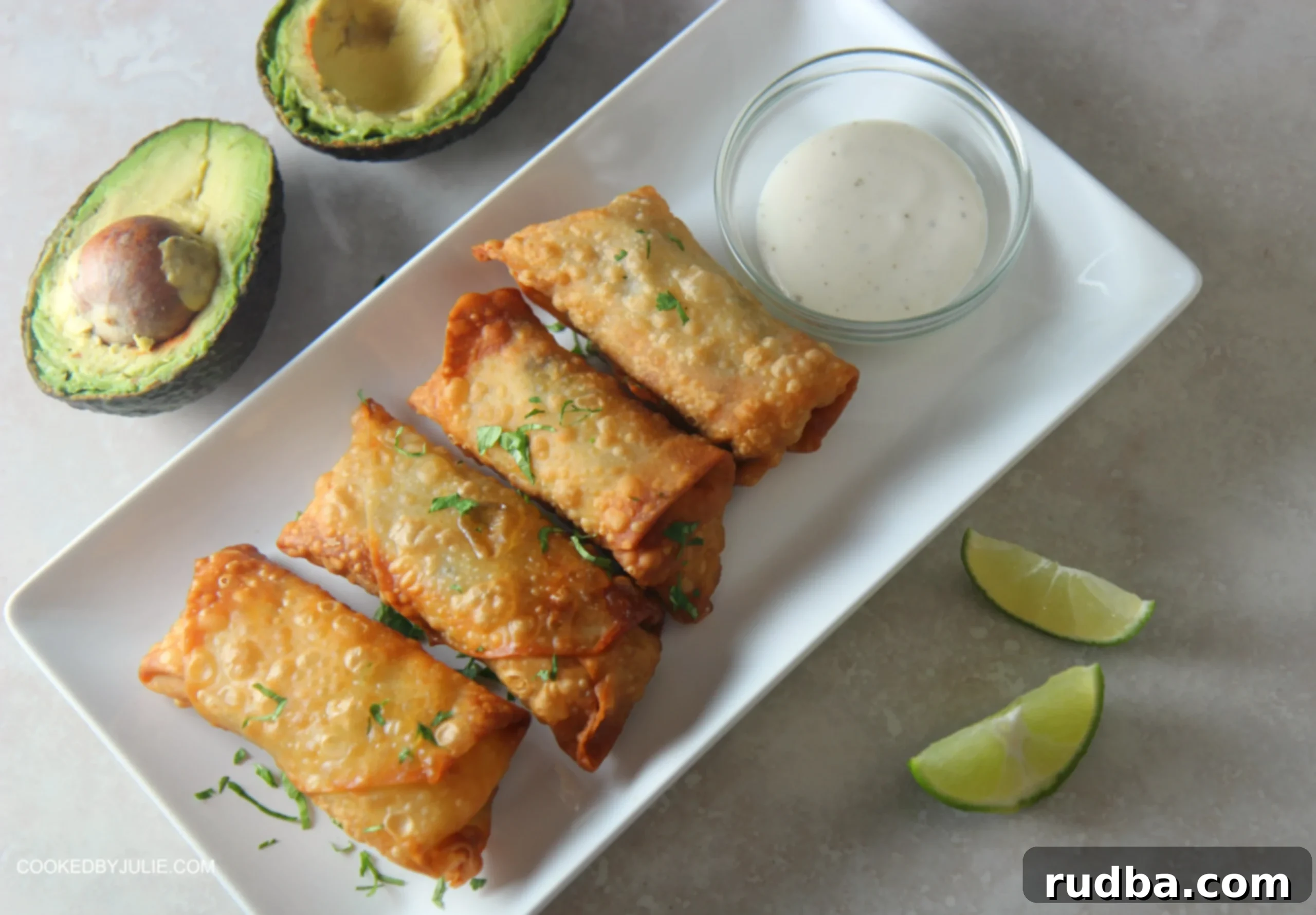 Serve these chicken avocado egg rolls with some ranch dipping sauce and lime wedges.