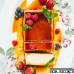Crème Caramel 5 Flan with berries and mint, sliced into, showing its creamy texture.