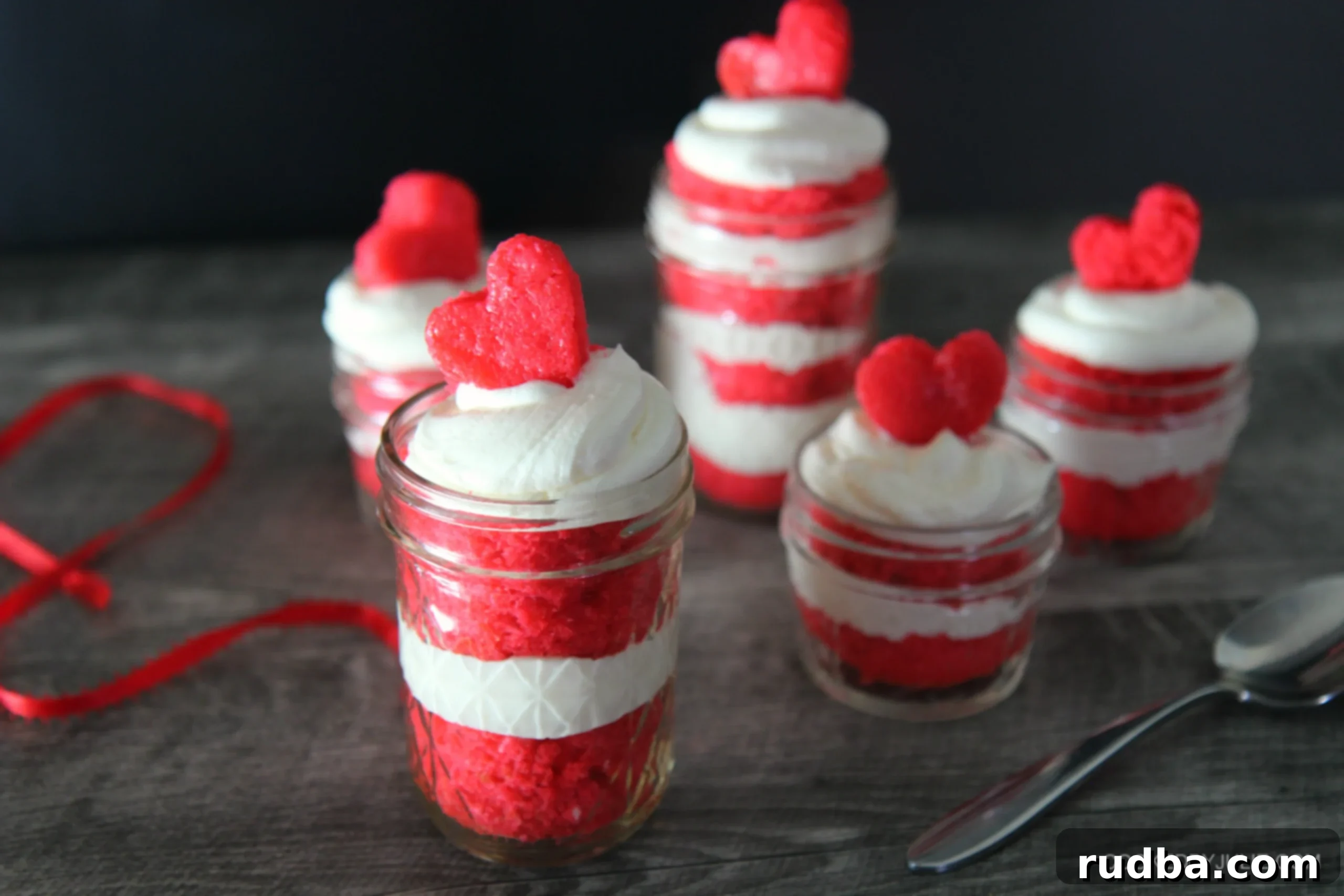 Stack and present the Red Velvet Cake Jars. You'll want to save one for yourself because they are so delicious.