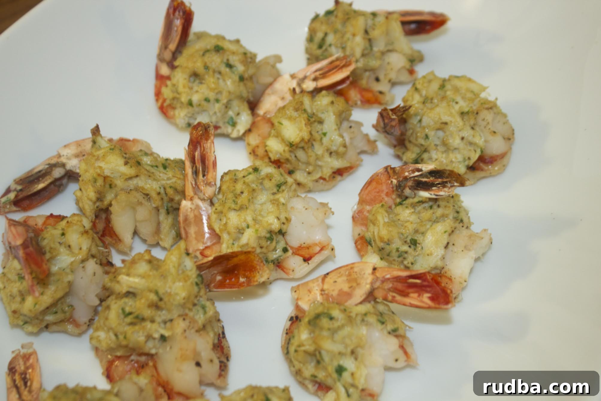 stuffed shrimp on a white platter 