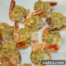 Gourmet Stuffed Shrimp 4 stuffed shrimp on a white platter