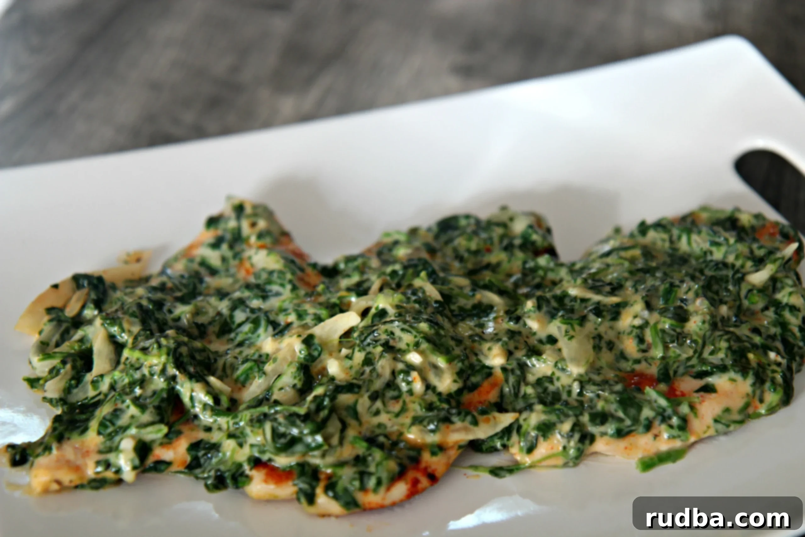 Tender and juicy chicken topped with delicious creamed spinach