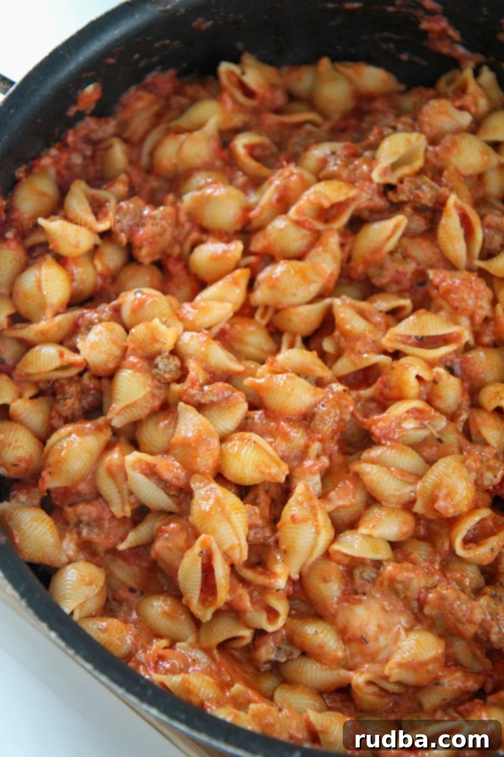 Beef and shells in a large black skillet, ready to be served