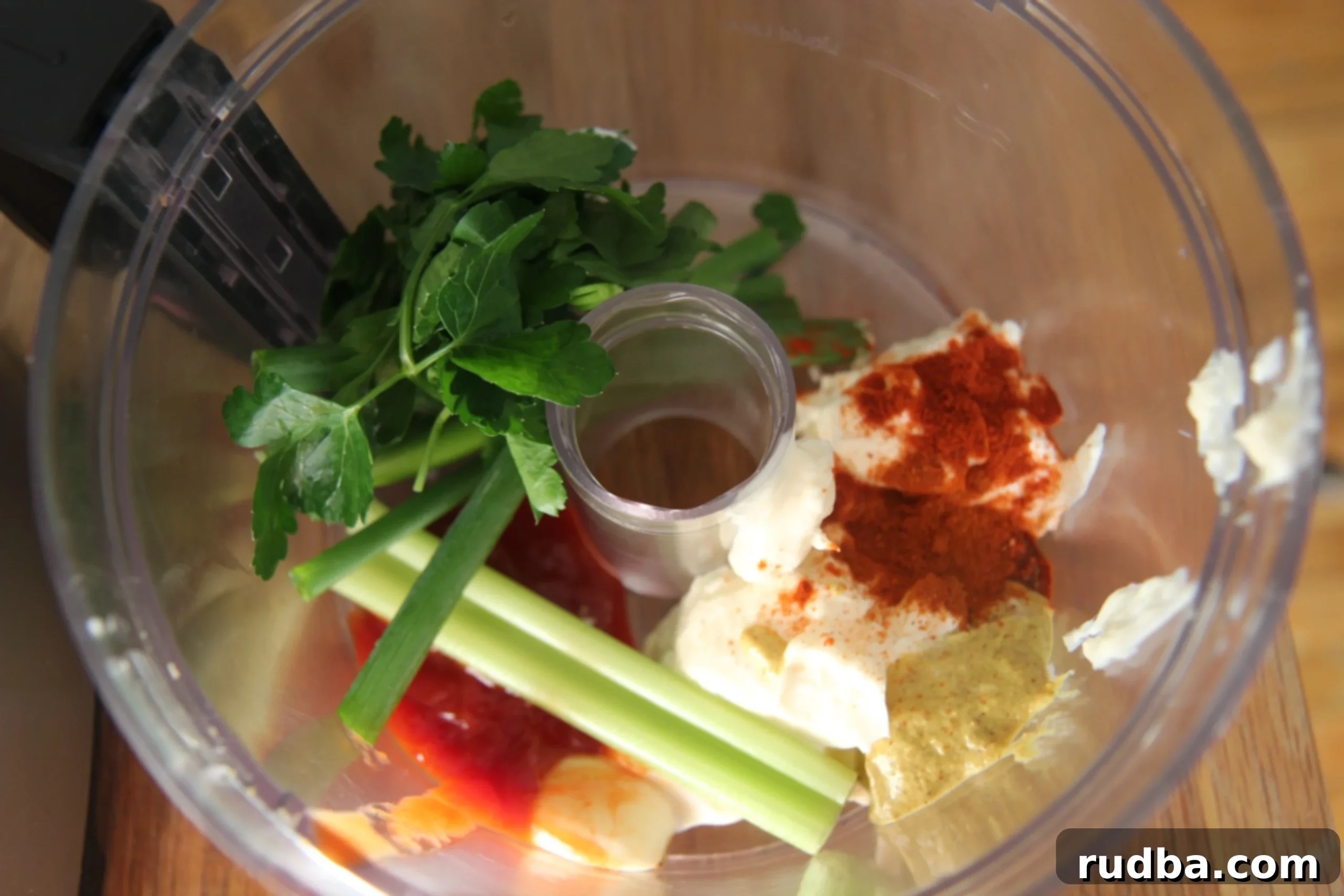 celery, mayo, spices, and fresh herbs in a food processor. 