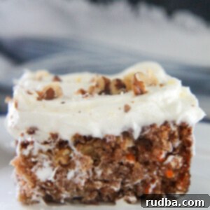 Ultimate Carrot Sheet Cake with Cream Cheese Frosting 7 a slice of carrot cake up close