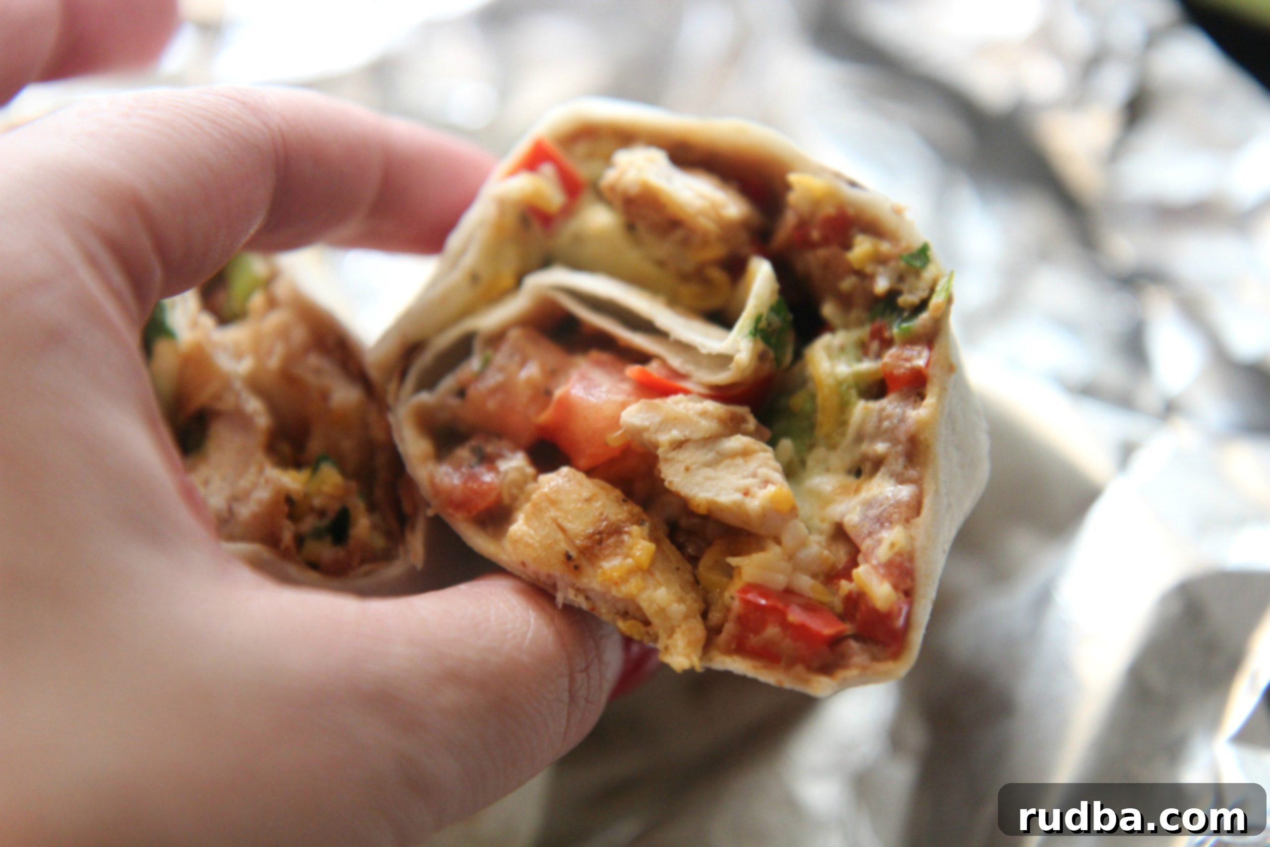 Served with sour cream and hot sauce, this Tex-Mex burrito is the perfect lunch.