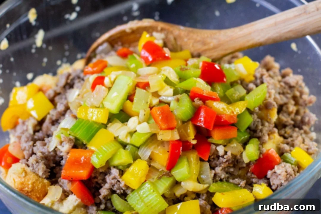 stuffing mixture in a glass bowl with a wooden spoon 