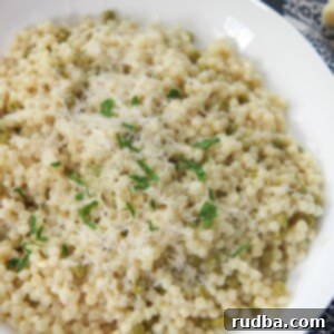 Lemony Israeli Couscous 5 couscous with parmesan cheese and parsley in a white plate