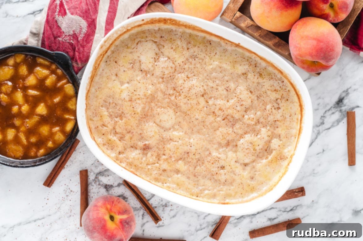 Peachy Rice Dream 3 Close-up of baked rice pudding in a casserole dish, garnished with cinnamon sticks and a bowl of fresh peach compote, highlighting the rich texture and vibrant colors.