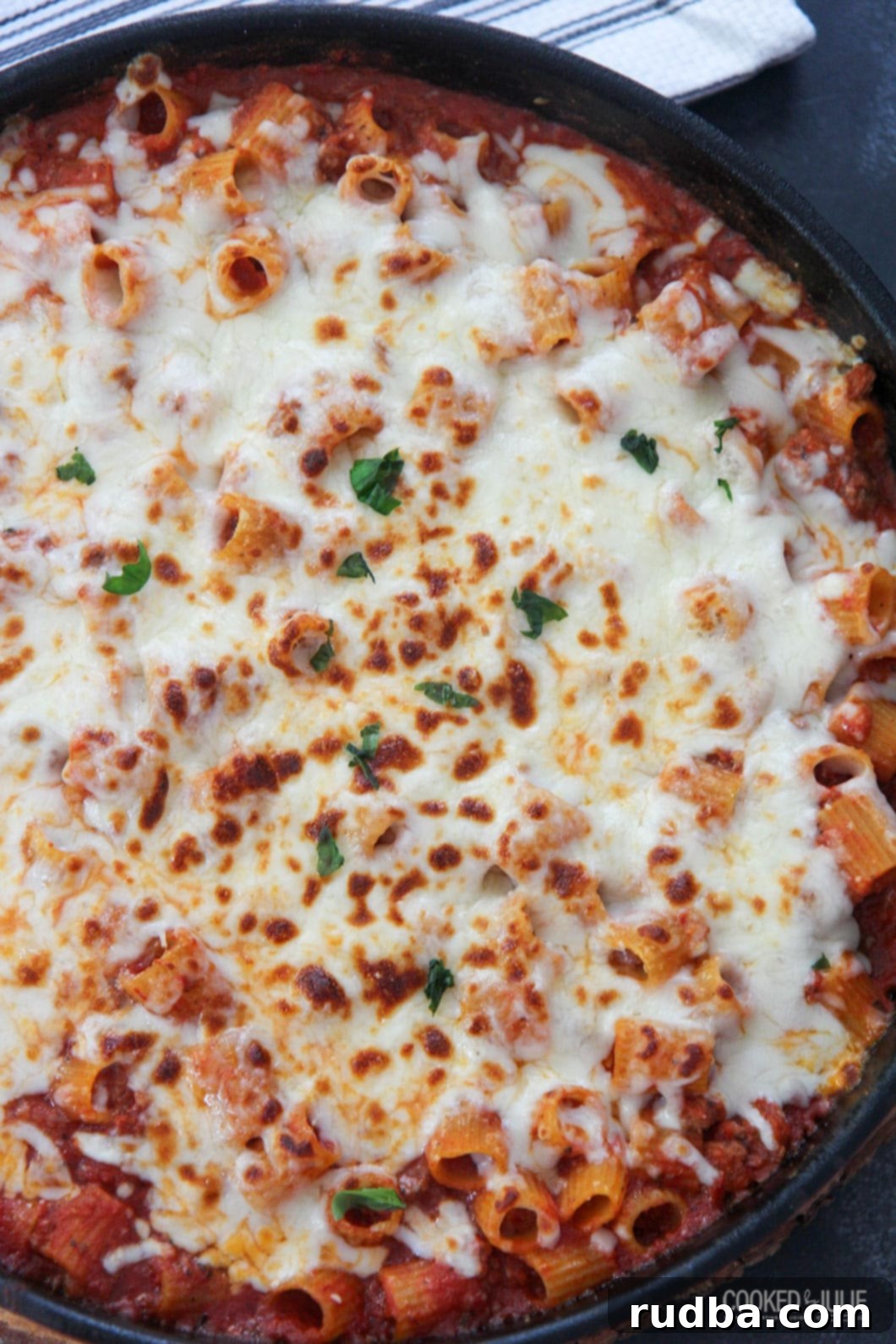 rigatoni al forno in a black skillet